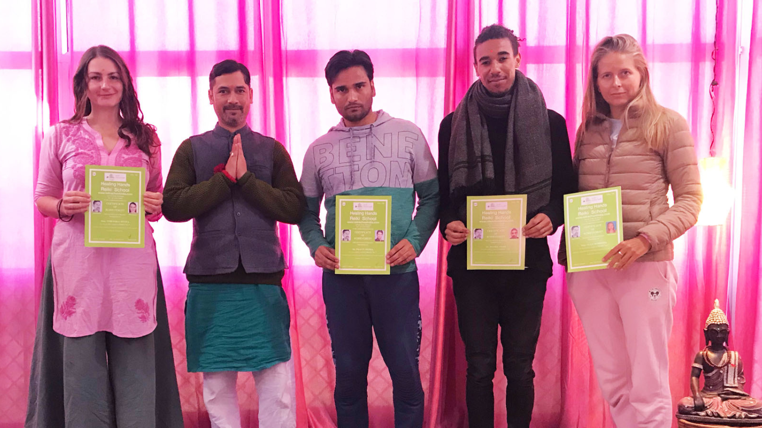 International students receiving Reiki course certificates after completing Reiki training at Reiki School India, Rishikesh.